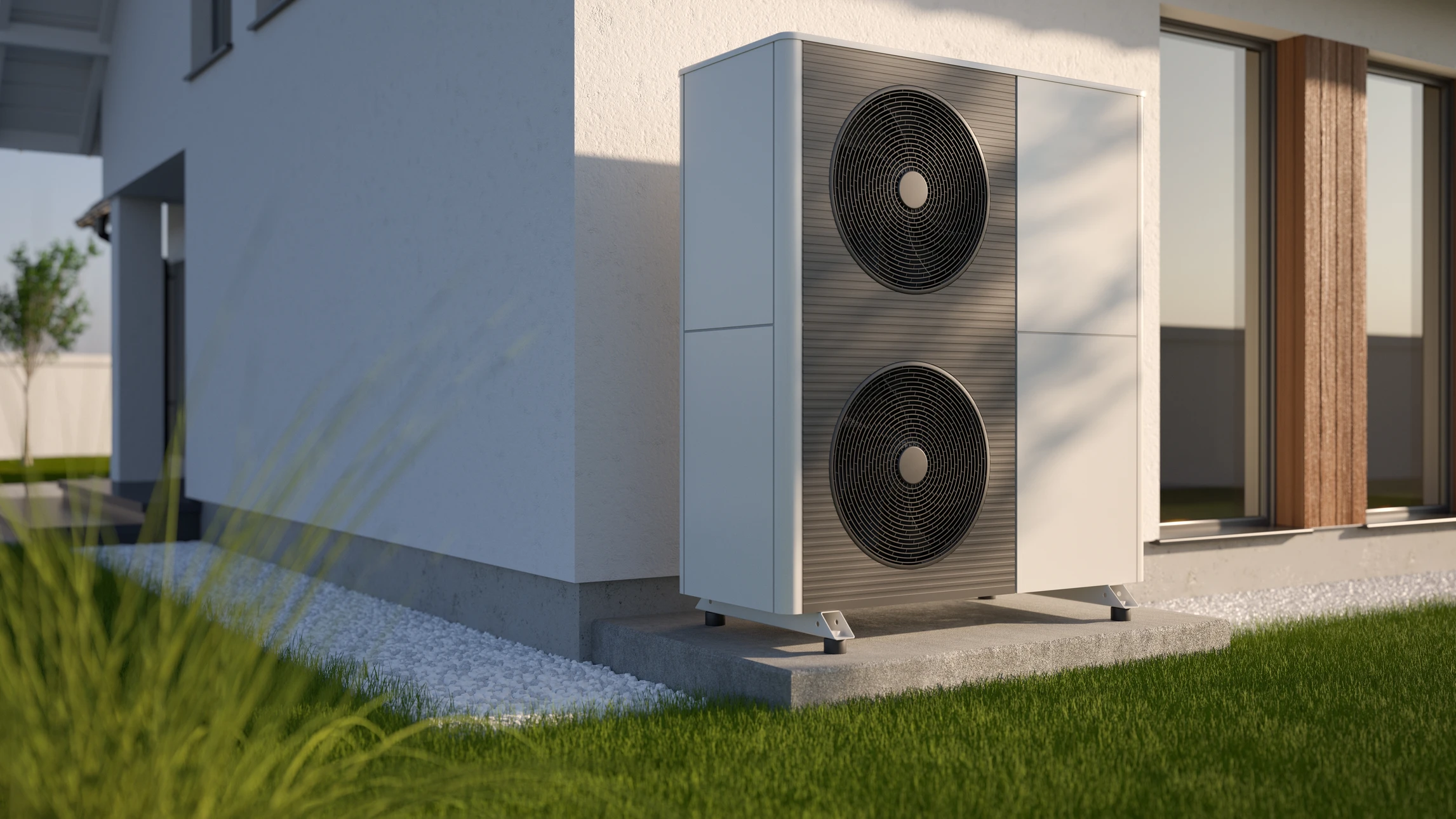 Extérieur résidentiel moderne avec pompe à chaleur air-eau installée sur terrasse pavée